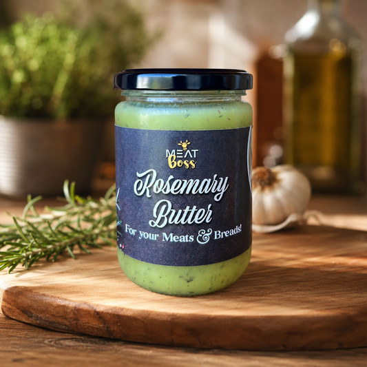 Jar of Meat Boss Rosemary Butter on a rustic wooden board with rosemary and garlic in a gourmet kitchen background.